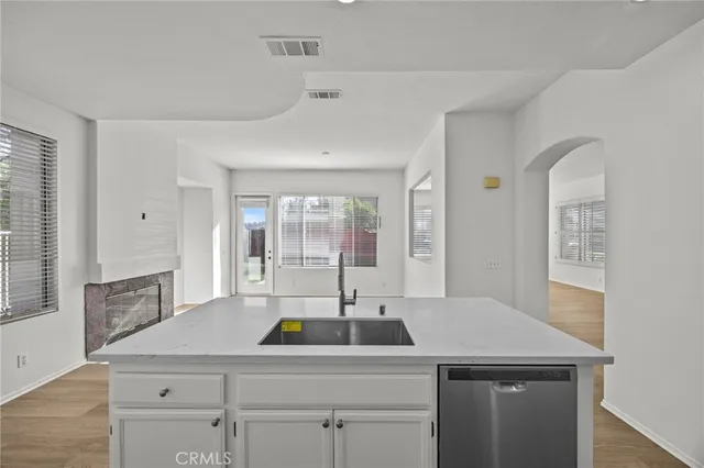 a kitchen with a sink and cabinets