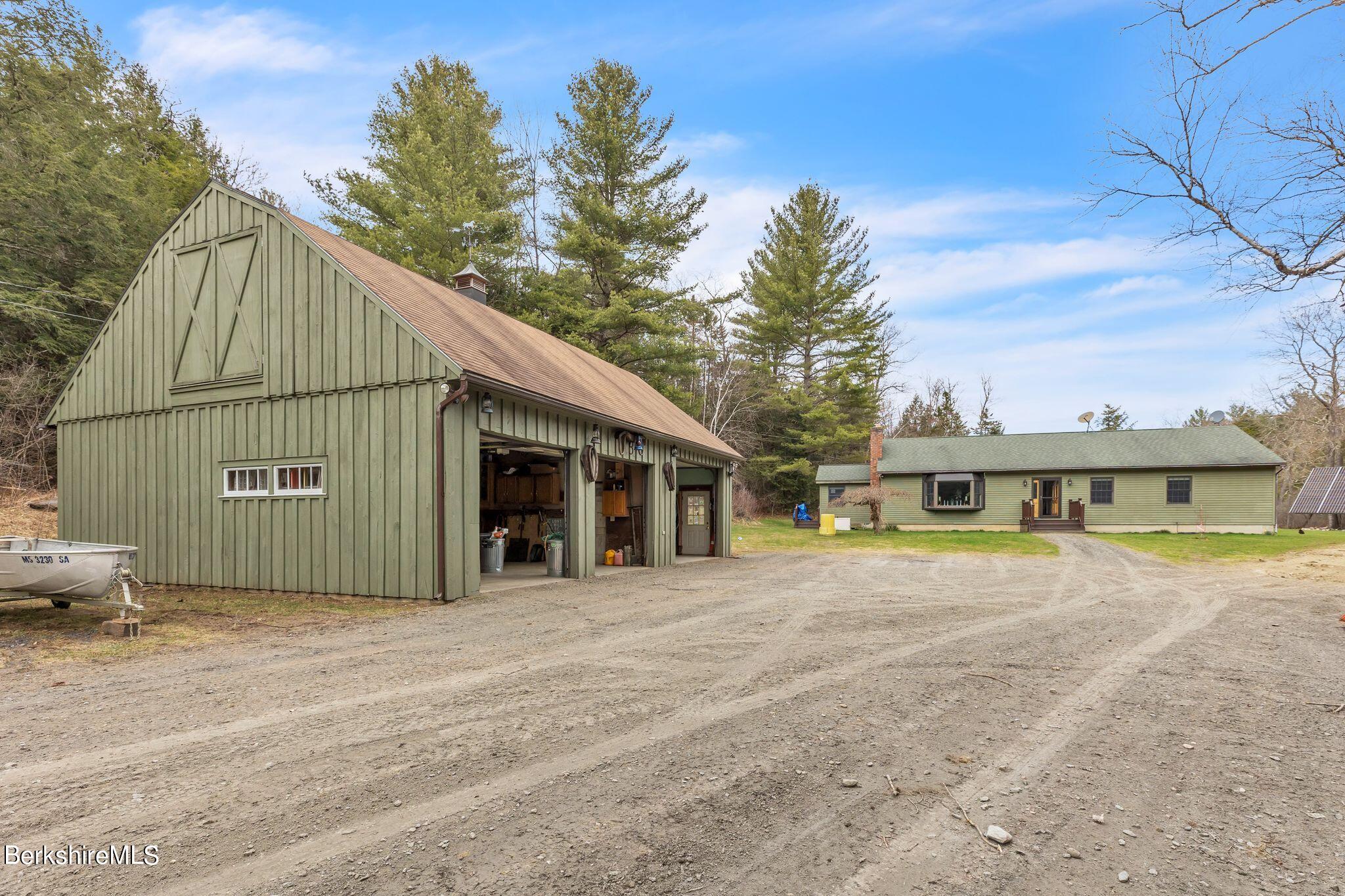 696 River Road Windsor, MA 01270 - Photo 29 of 42 a view of a house with a backyard