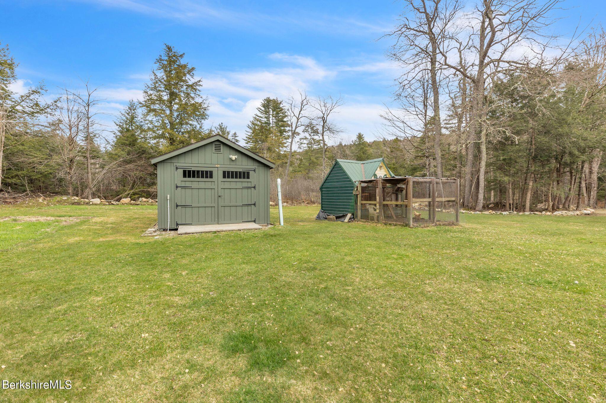 696 River Road Windsor, MA 01270 - Photo 32 of 42 a view of a house with a yard