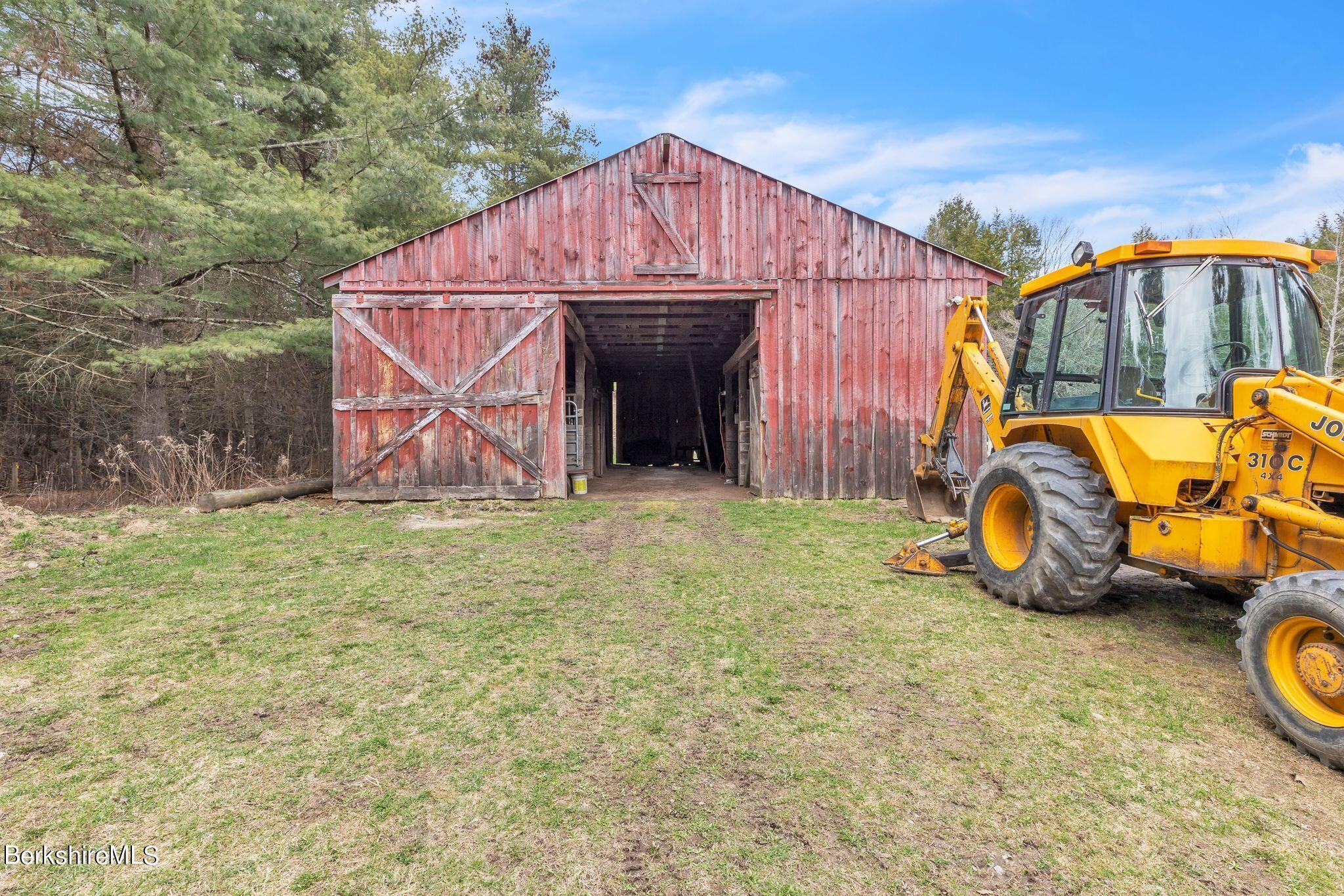 696 River Road Windsor, MA 01270 - Photo 33 of 42 a view of a backyard with table and chairs and a barbeque
