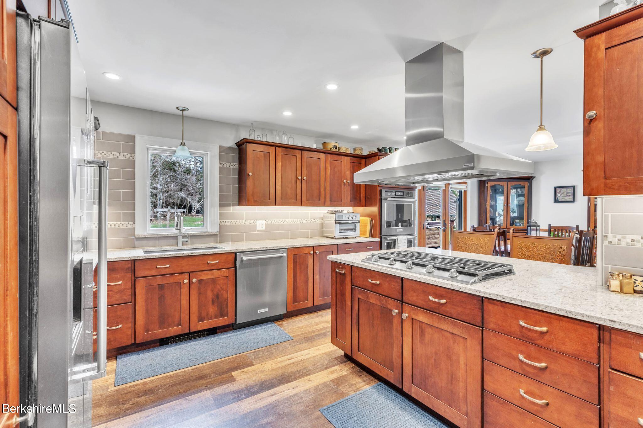 696 River Road Windsor, MA 01270 - Photo 4 of 42 a kitchen with stainless steel appliances granite countertop wooden cabinets and a granite counter tops