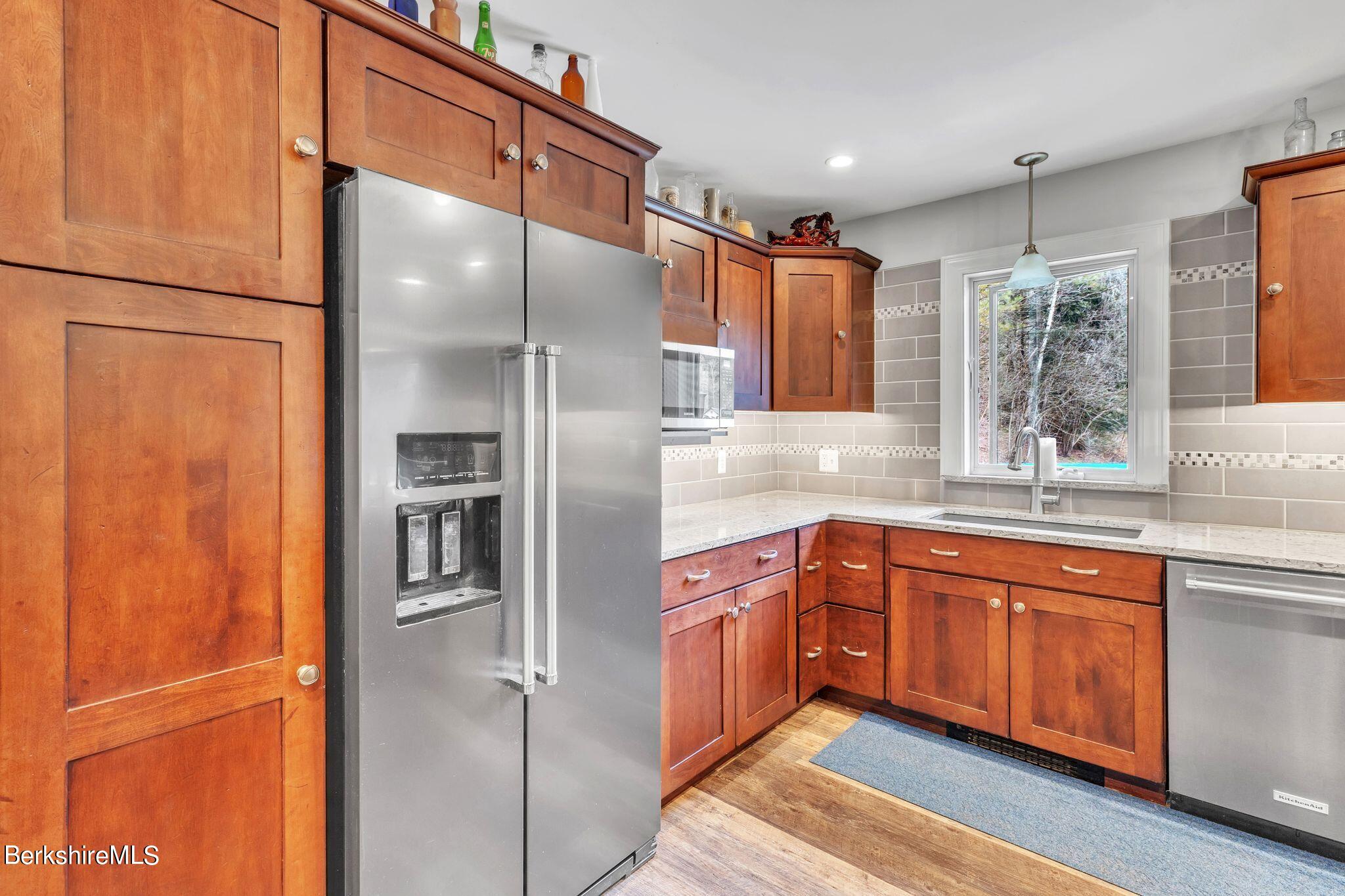 696 River Road Windsor, MA 01270 - Photo 6 of 42 a kitchen with stainless steel appliances granite countertop a refrigerator and a sink