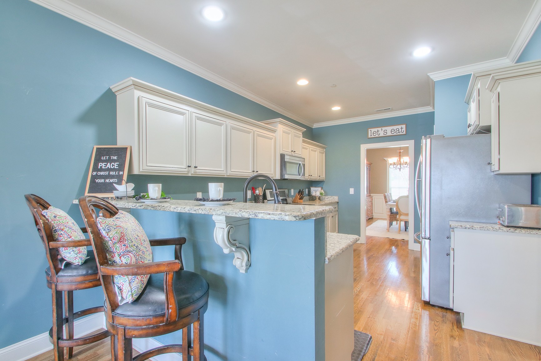 1102 Black Jack Way Murfreesboro, TN 37129 - Photo 23 of 48 a kitchen with a table chairs refrigerator and cabinets