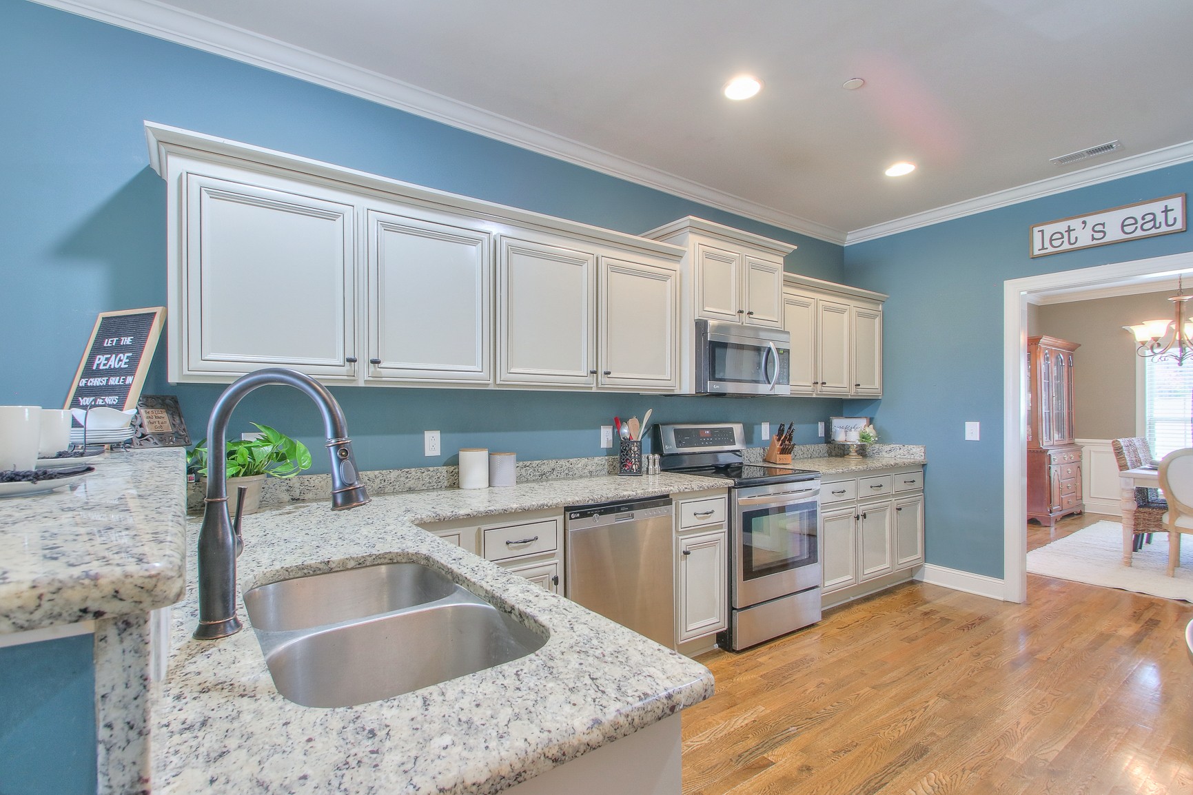 1102 Black Jack Way Murfreesboro, TN 37129 - Photo 24 of 48 a kitchen with stainless steel appliances granite countertop a sink stove and cabinets