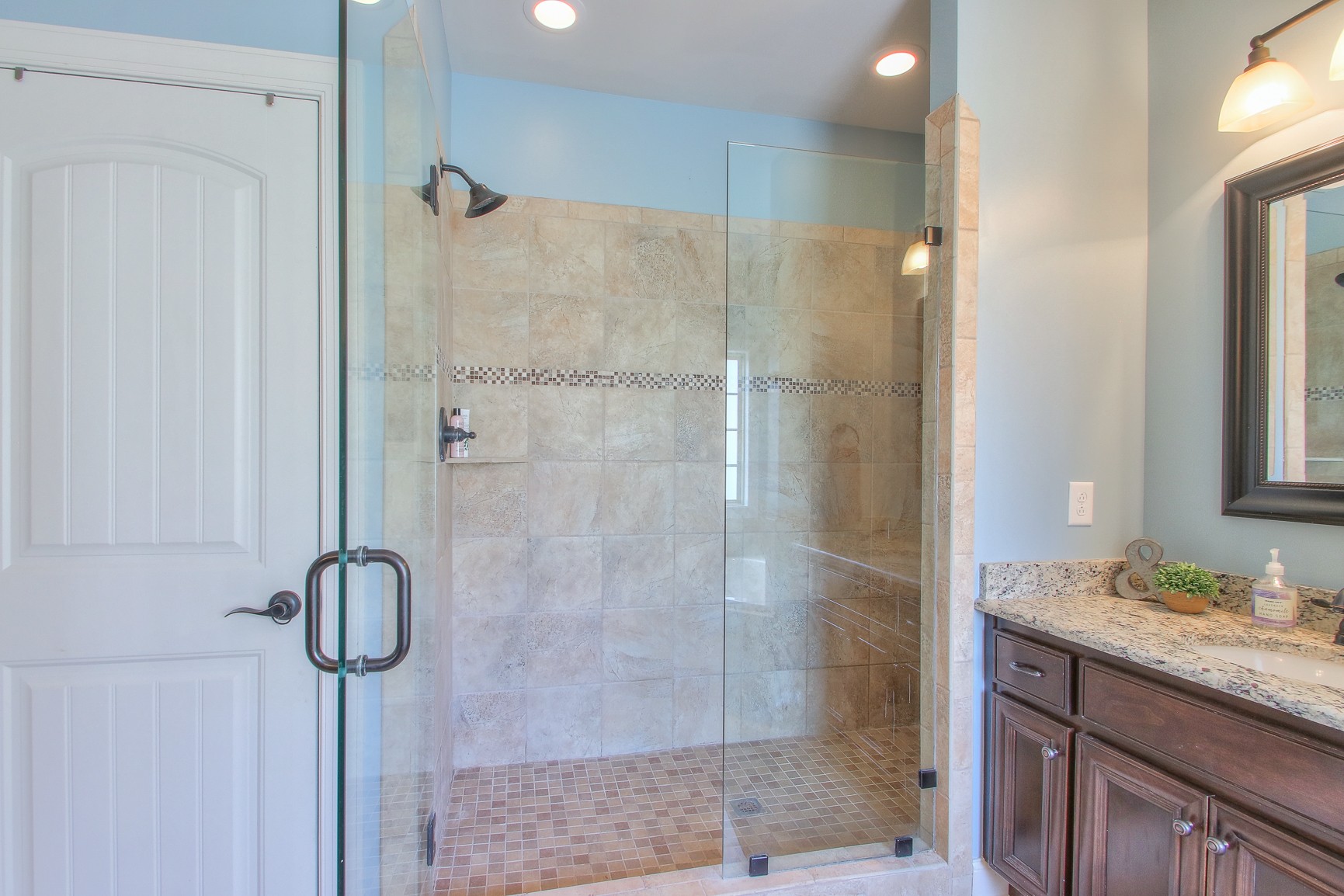 1102 Black Jack Way Murfreesboro, TN 37129 - Photo 32 of 48 a bathroom with a granite countertop shower sink and mirror