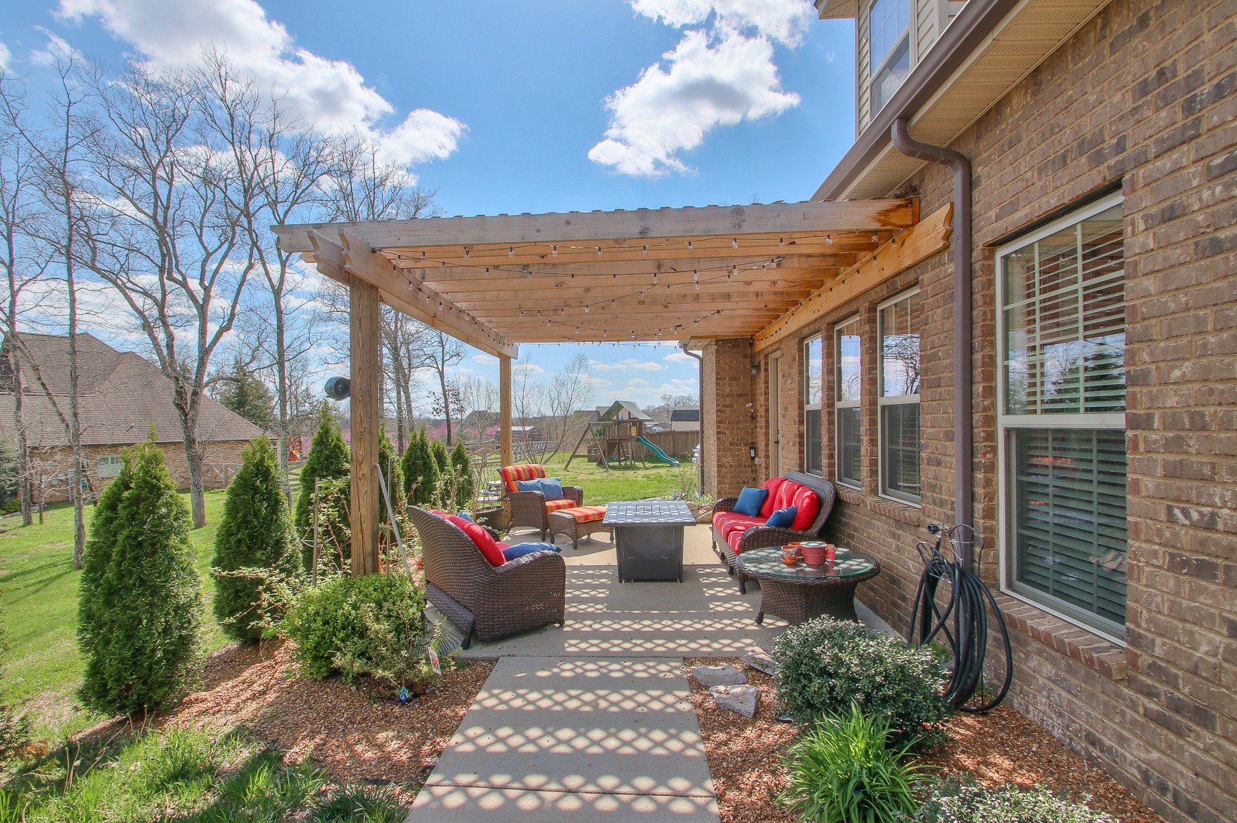 1102 Black Jack Way Murfreesboro, TN 37129 - Photo 8 of 48 a view of a patio with couches table and chairs and potted plants