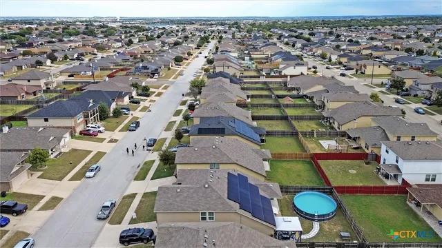 an aerial view of a city with lots of residential buildings