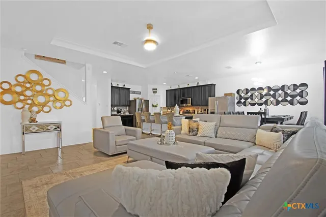 a living room with furniture and a table