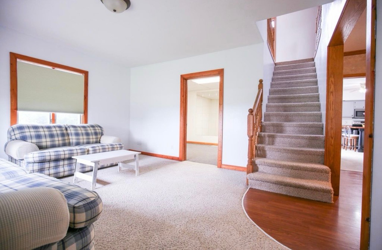 382 Keigwin Road Walnut, IL 61376 - Photo 31 of 49 a bedroom with furniture and a potted plant