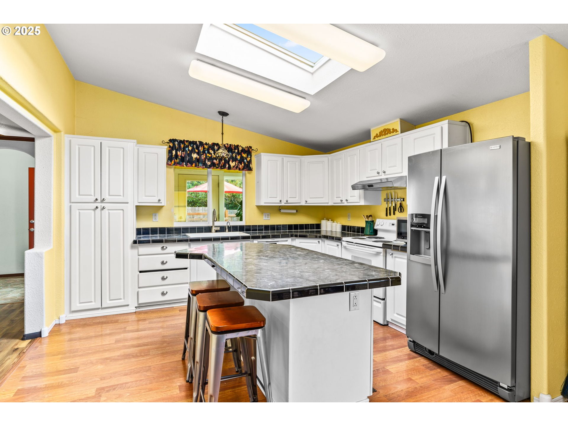 47849 West 2nd Street Oakridge, OR 97463 - Photo 11 of 45 a kitchen with stainless steel appliances granite countertop a kitchen island a stove a refrigerator and a refrigerator