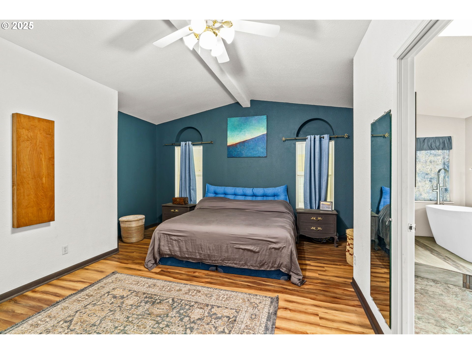 47849 West 2nd Street Oakridge, OR 97463 - Photo 15 of 45 a bedroom with a bed a mirror and desk