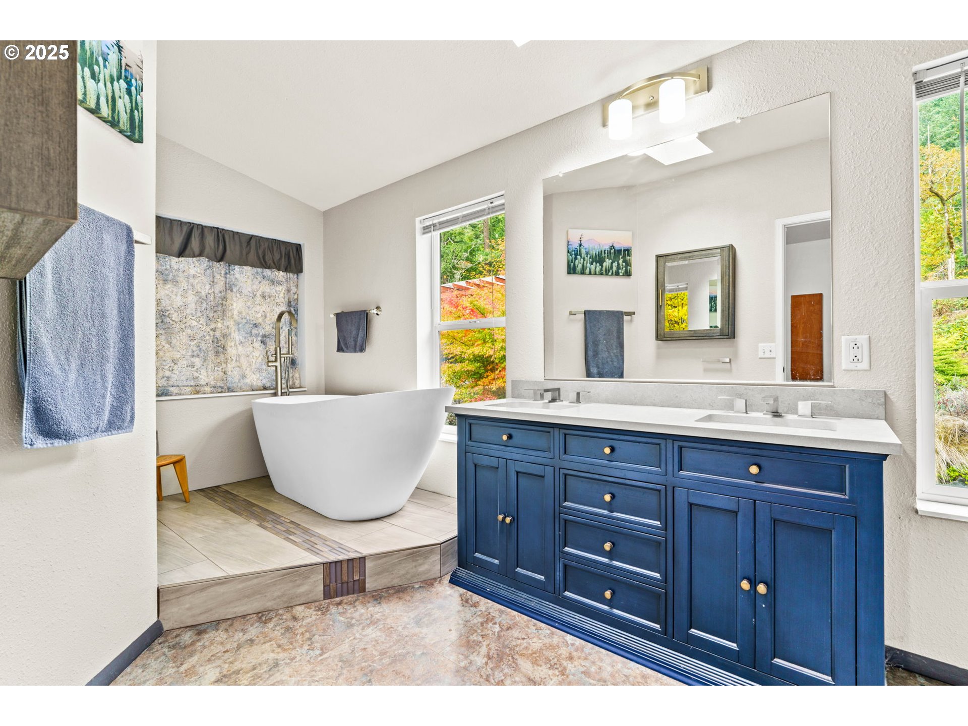 47849 West 2nd Street Oakridge, OR 97463 - Photo 17 of 45 a bathroom with a tub a sink and a window