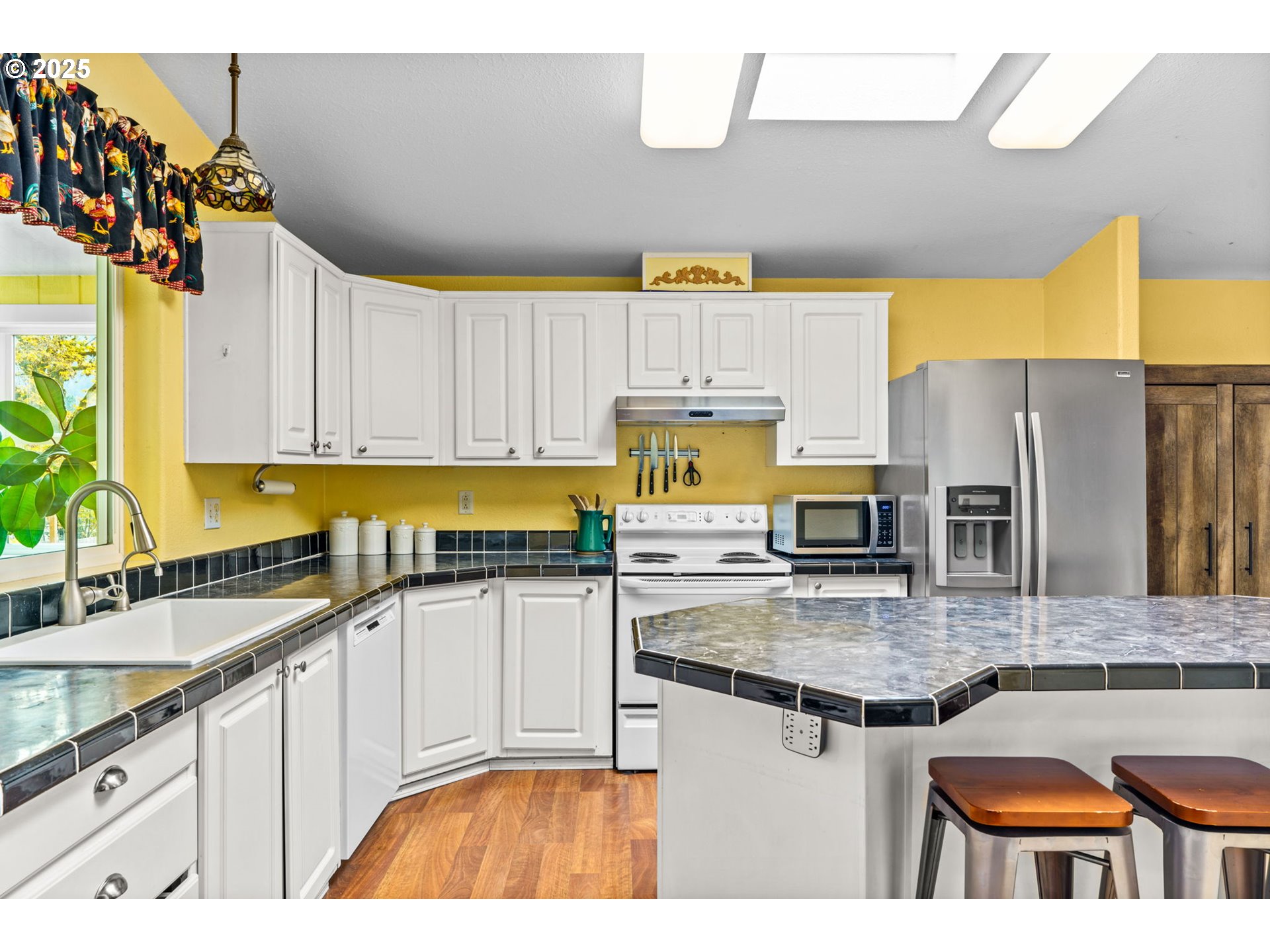 47849 West 2nd Street Oakridge, OR 97463 - Photo 10 of 45 a kitchen with stainless steel appliances granite countertop a sink a stove and cabinets