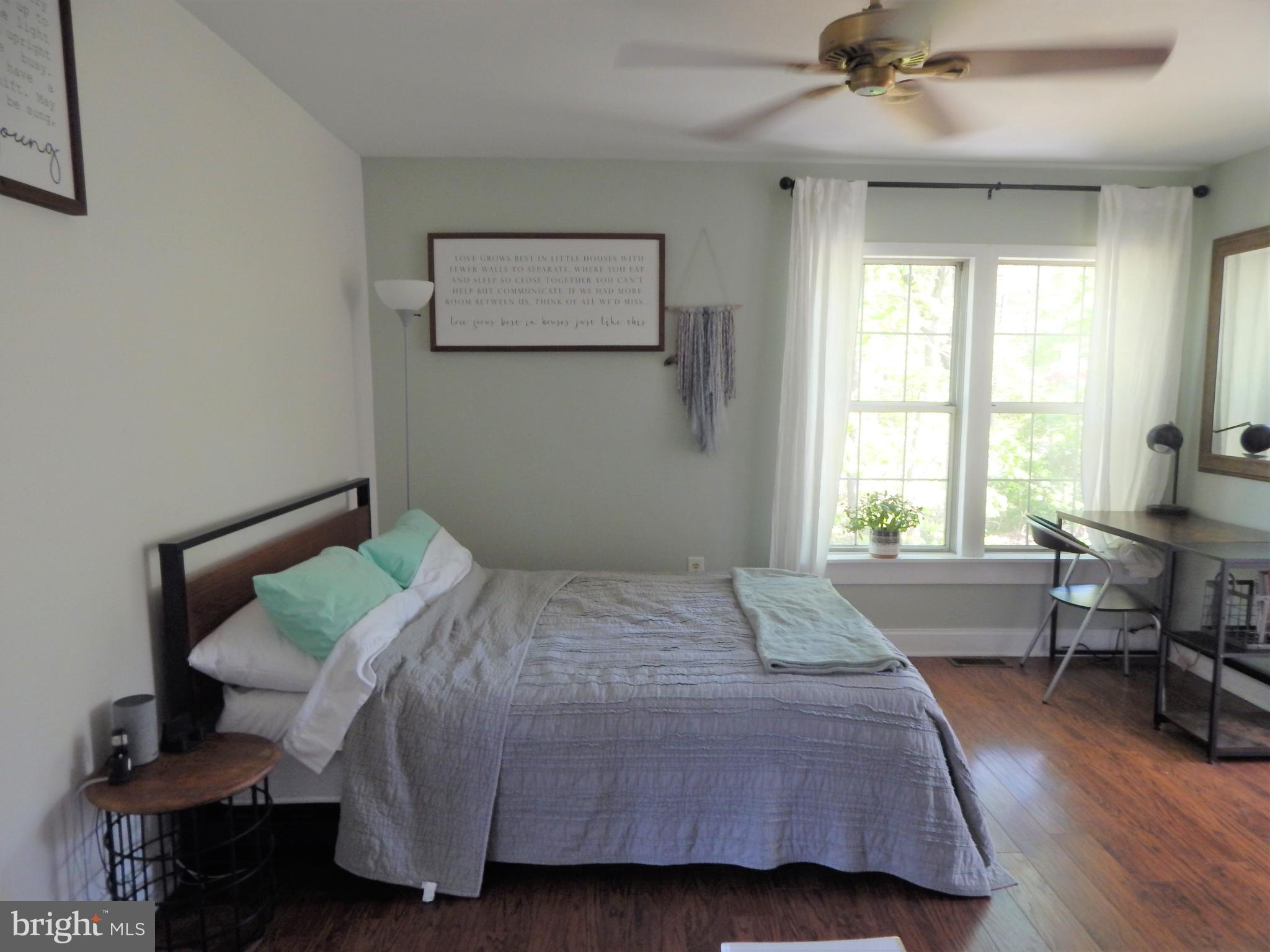 6024 Poplar Road St. Leonard, MD 20685 - Photo 22 of 30 Primary bedroom with laminate floor