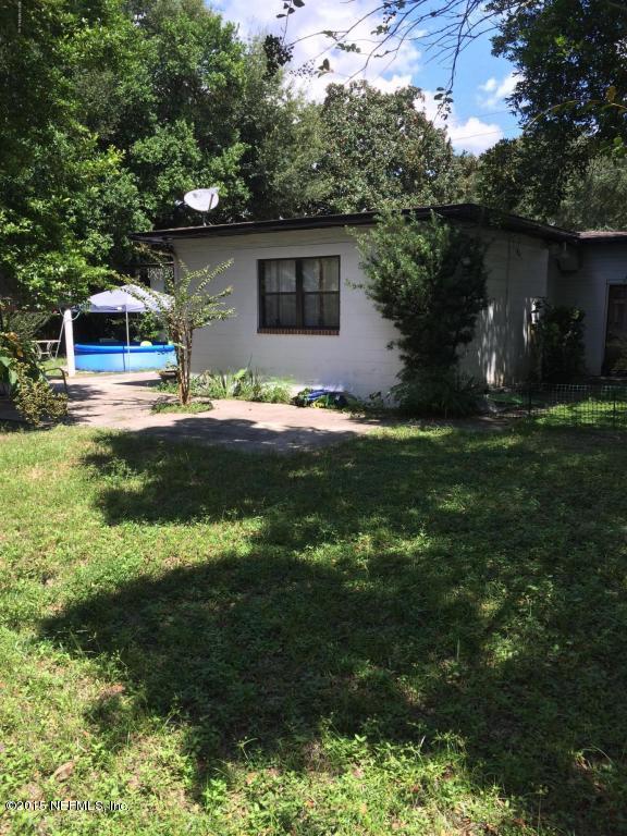3138 Rogero Road Jacksonville, FL 32277 - Photo 7 of 12 a front view of house with yard and green space