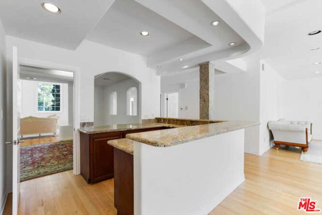 a kitchen with stainless steel appliances granite countertop a stove and a sink