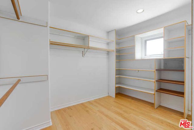 a view of a yard with wooden fence