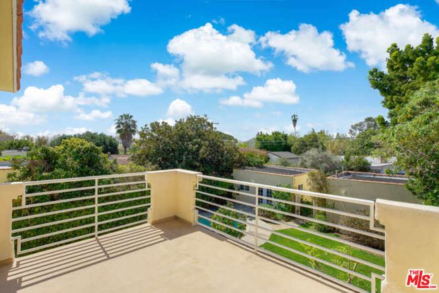 a view of a swimming pool with a yard