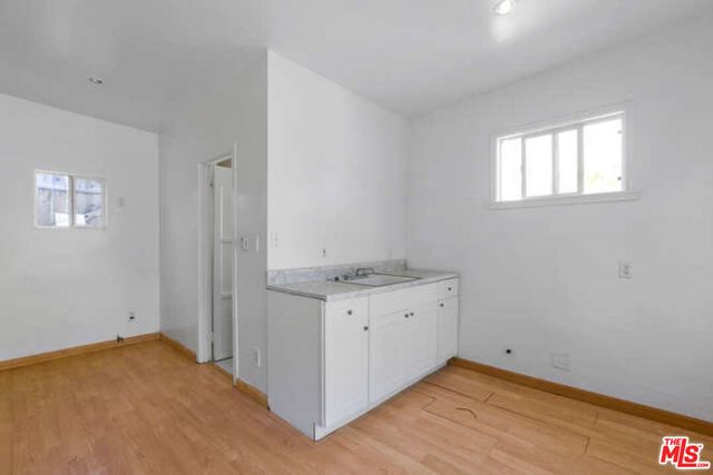 a bathroom with a sink toilet and a mirror