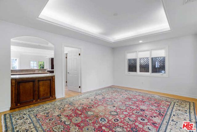 a kitchen with a sink and a stove top oven