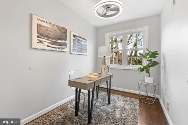 a view of a workspace with furniture