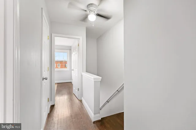 a view of a hallway with a white walls