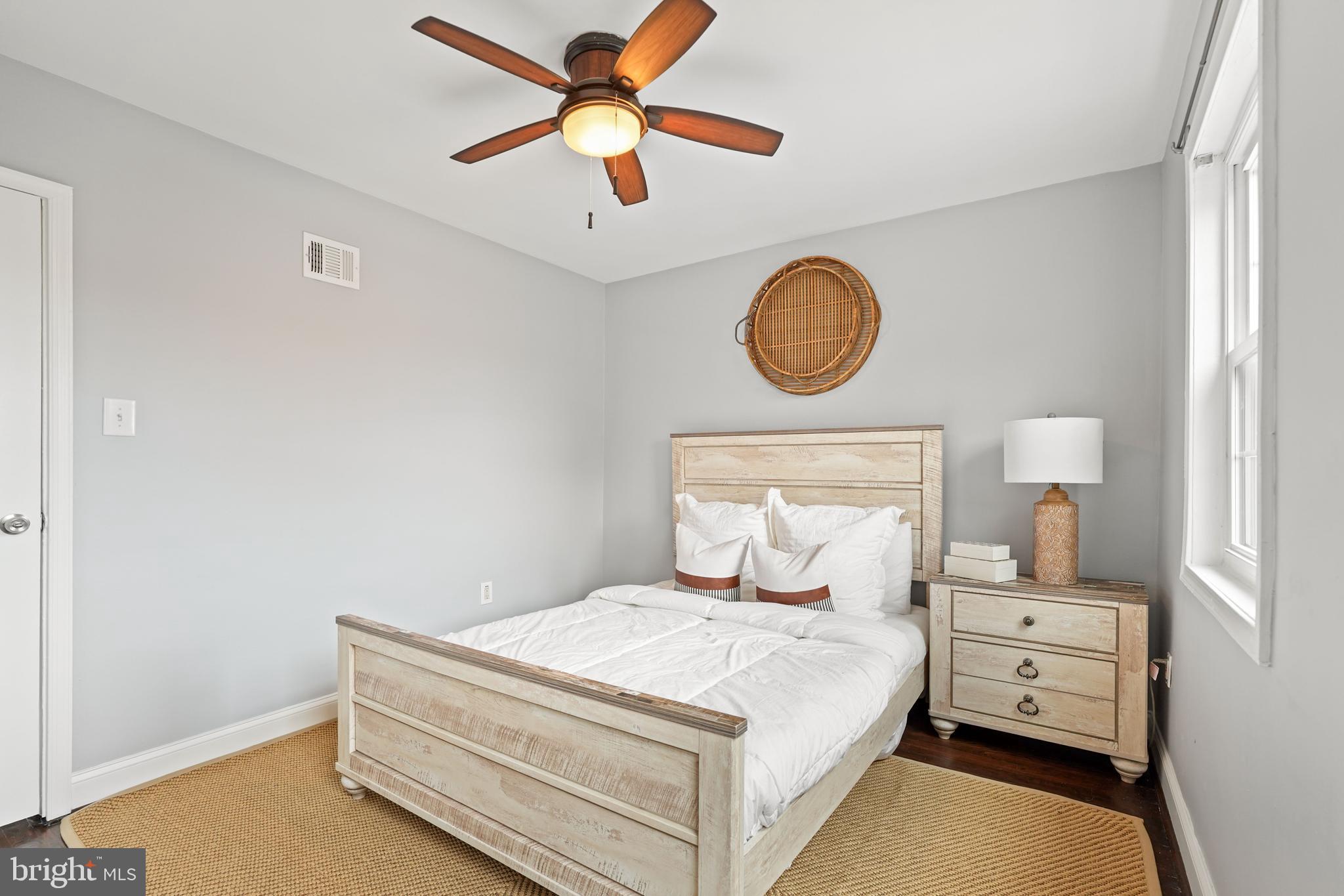 44 Dale Street Alexandria, VA 22305 - Photo 25 of 40 a bedroom with a bed and a chandelier