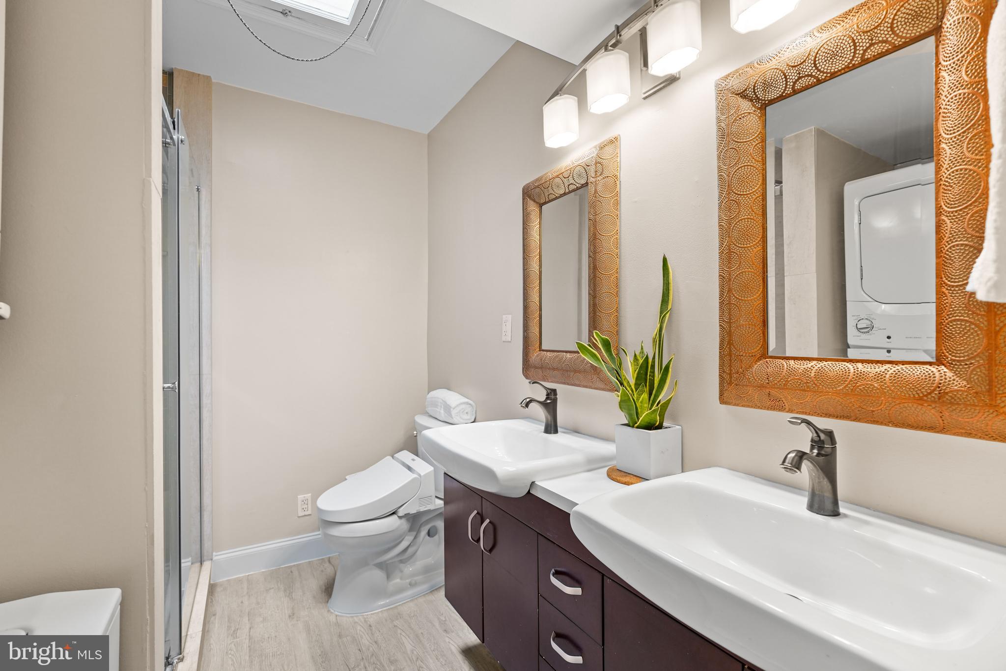 44 Dale Street Alexandria, VA 22305 - Photo 26 of 40 a bathroom with a sink a toilet and a mirror