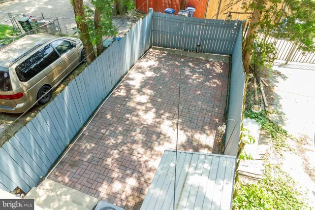 a view of a balcony with a tree