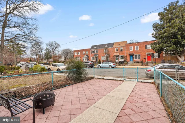 a view of a swimming pool and lounge chairs
