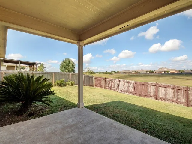 a view of a garden with a patio