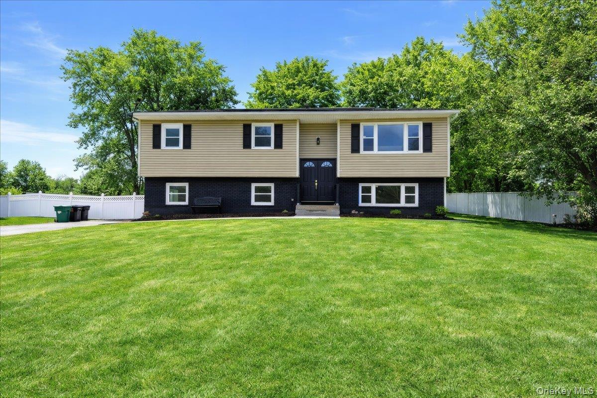 Split foyer home with brick siding
