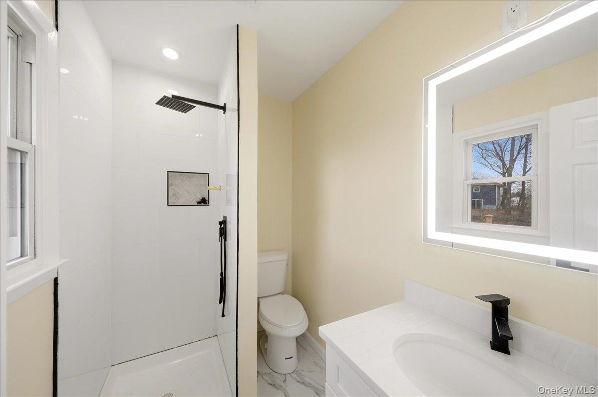 7 Gene Road Middletown, NY 10941 - Photo 18 of 43 Bathroom with vanity, a stall shower, and light marble finish flooring