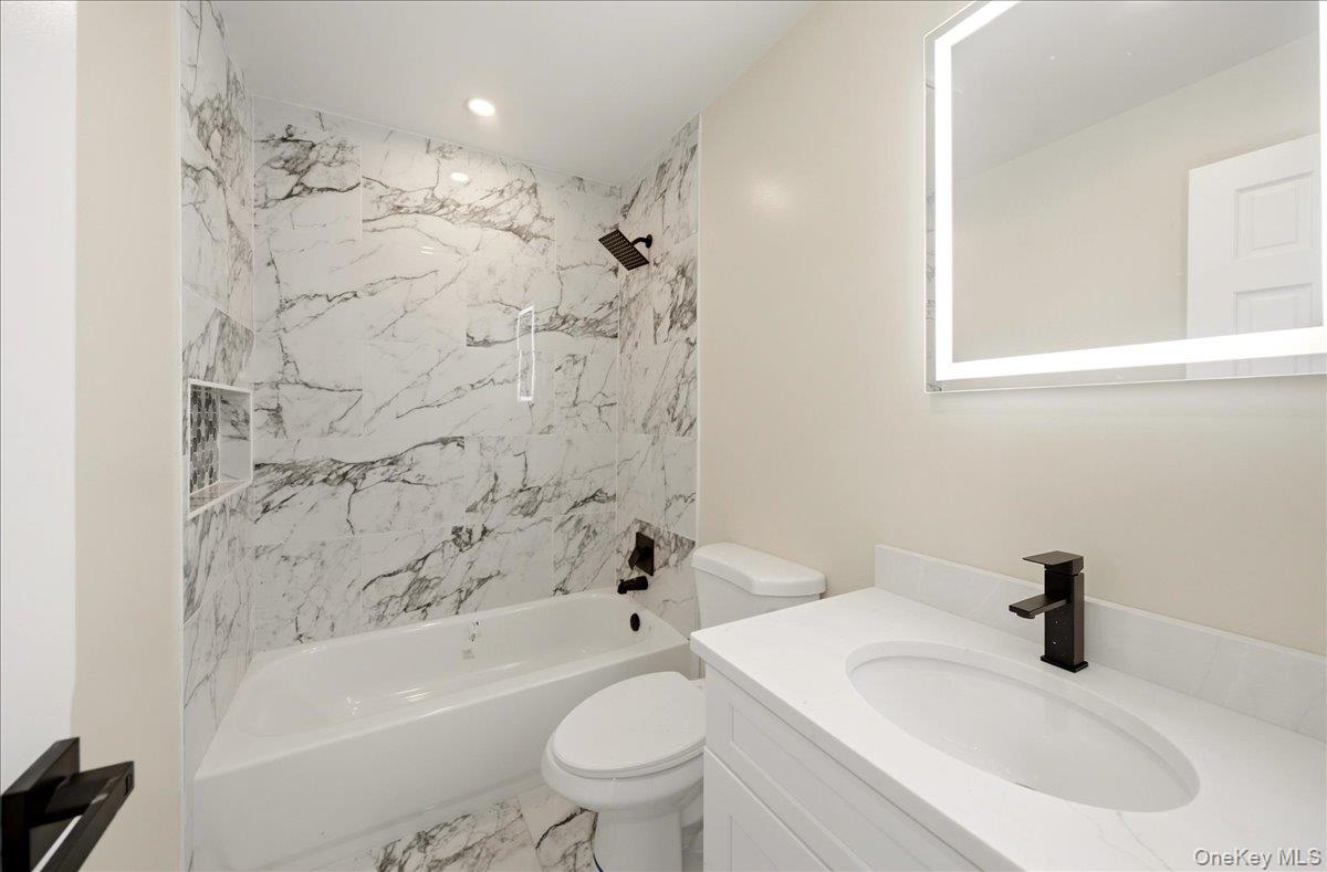 7 Gene Road Middletown, NY 10941 - Photo 22 of 43 Full bathroom featuring vanity, marble finish flooring, washtub / shower combination, and recessed lighting