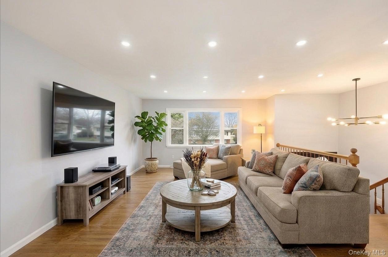 7 Gene Road Middletown, NY 10941 - Photo 7 of 43 Living room featuring light wood-type flooring and hanging lights