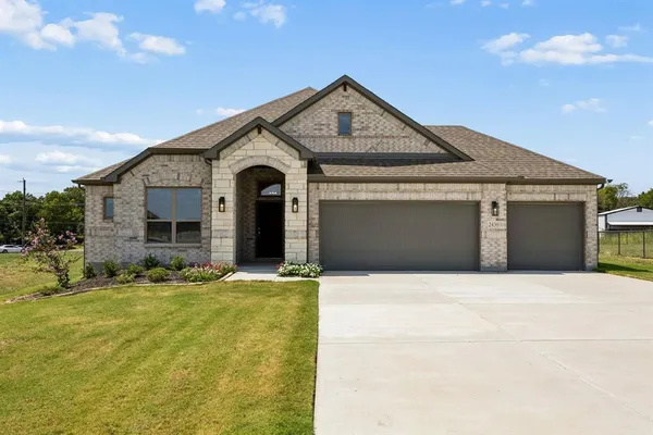 a front view of a house with yard