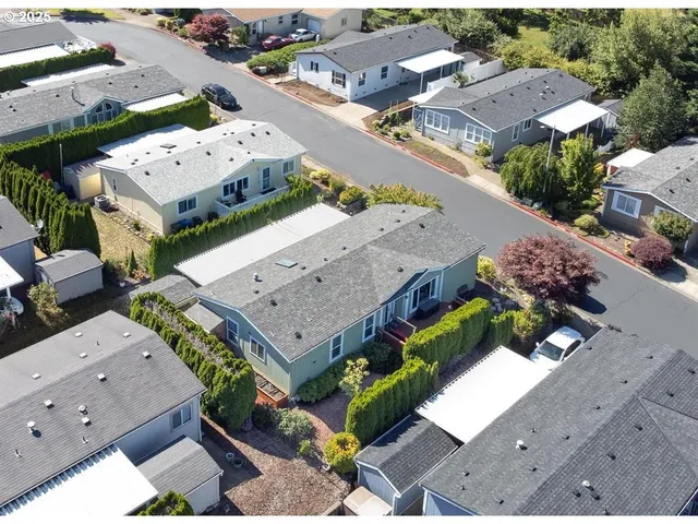 an aerial view of multiple houses with outdoor space