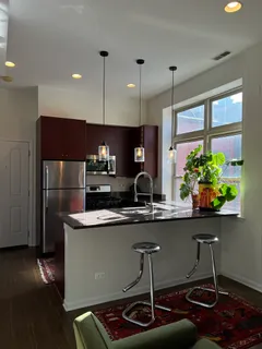 a kitchen with stainless steel appliances a sink and a stove