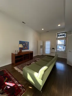 a bed sitting in a room next to a window