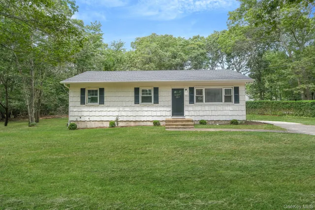 a front view of house with yard and front view of house