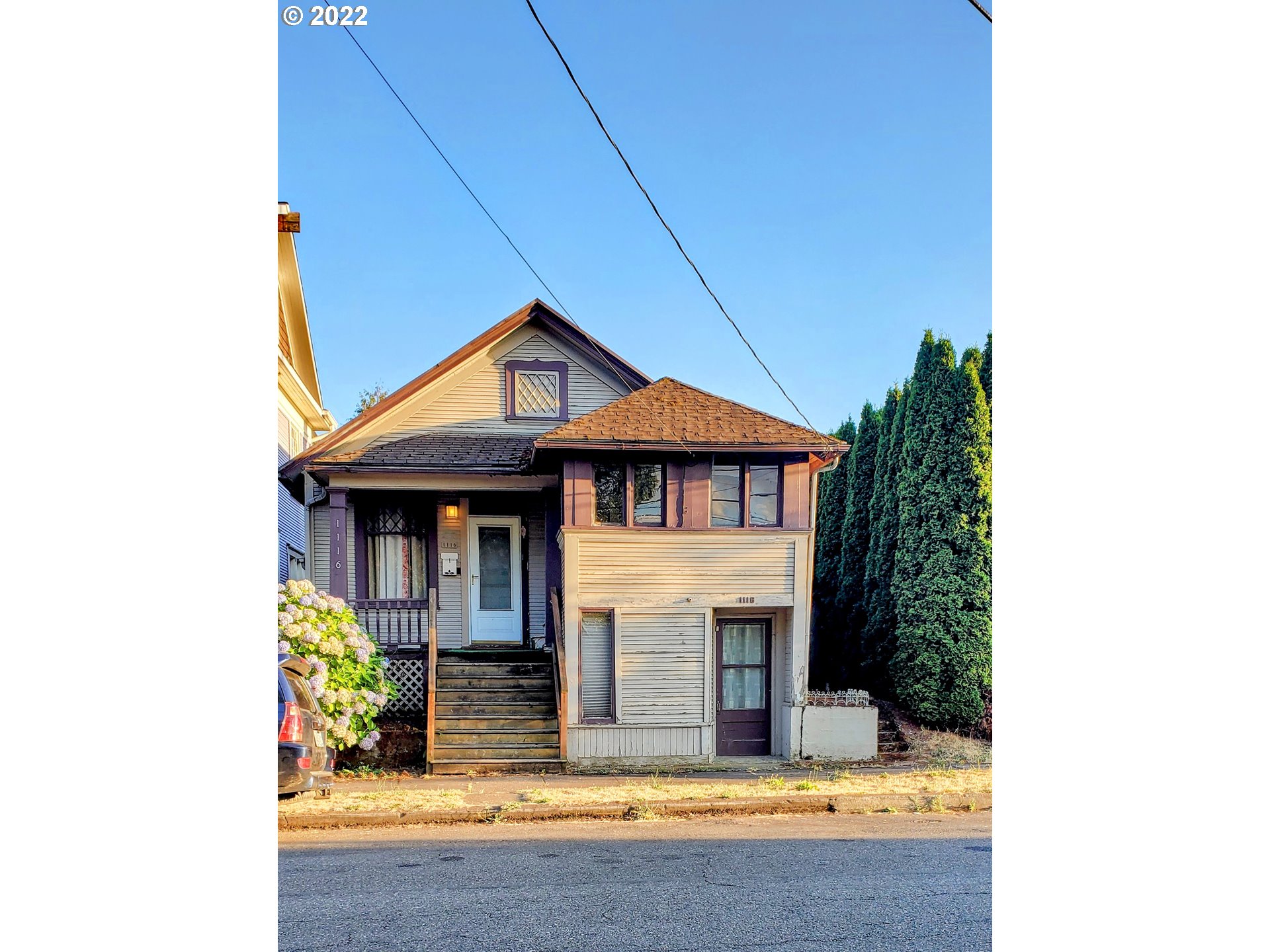 a front view of a house with yard