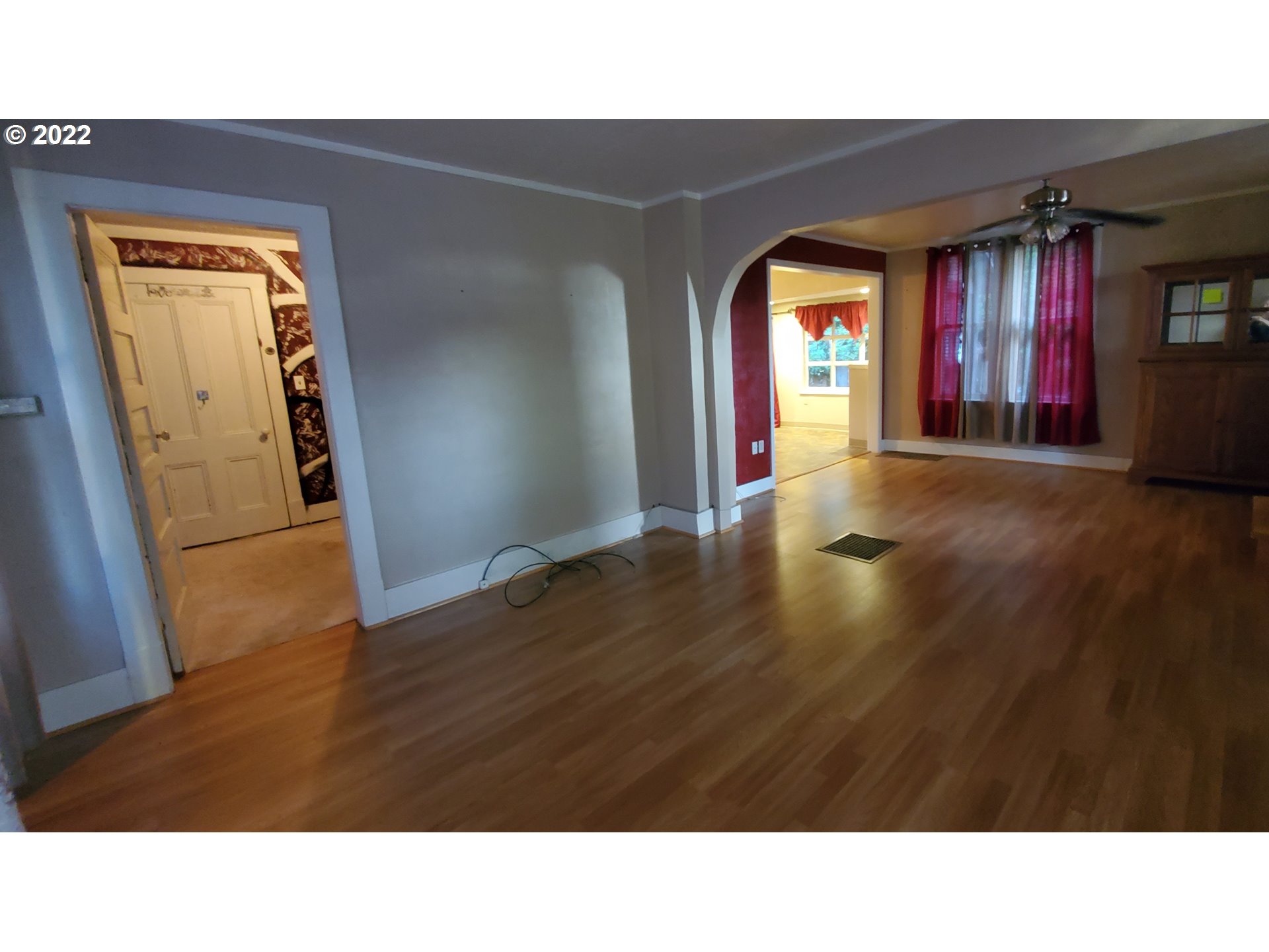 1116 Southeast Stephens Street Portland, OR 97214 - Photo 5 of 10 a room with wooden floor and windows