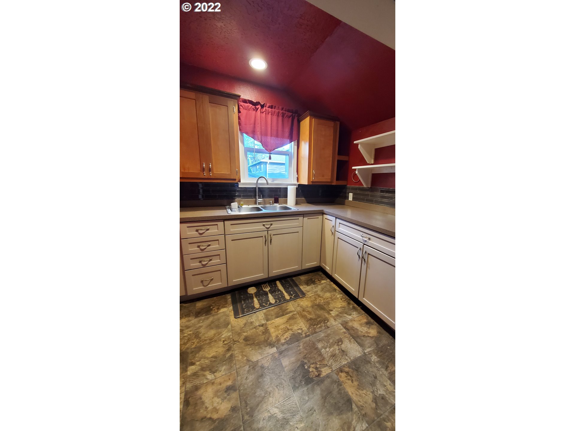 1116 Southeast Stephens Street Portland, OR 97214 - Photo 7 of 10 a kitchen with a sink cabinets and a window