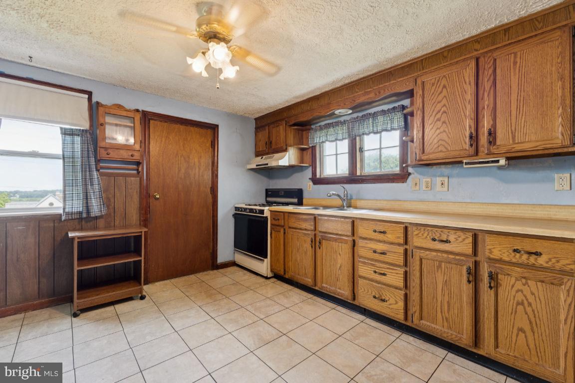 1614 Gablehammer Road Westminster, MD 21157 - Photo 9 of 32 a kitchen with cabinets a sink and appliances