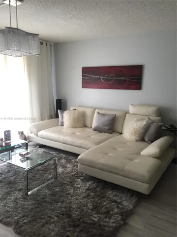 a kitchen with a sink stove and microwave