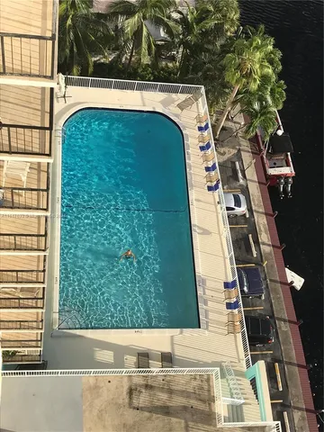 a view of swimming pool from a balcony