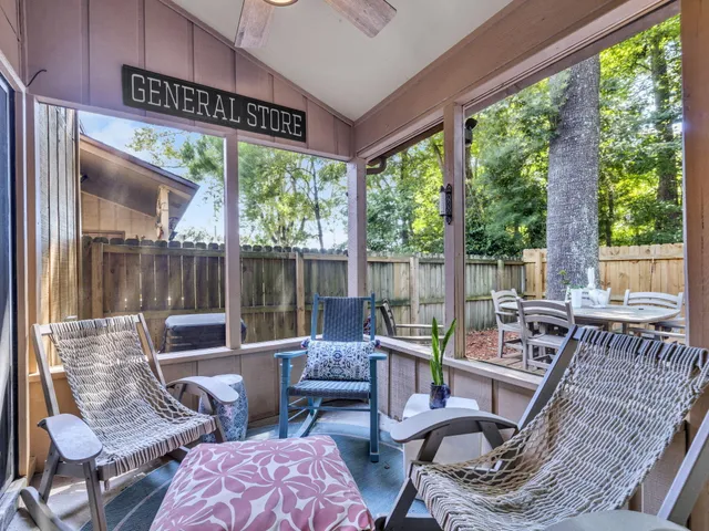a patio with yard glass top table and chairs
