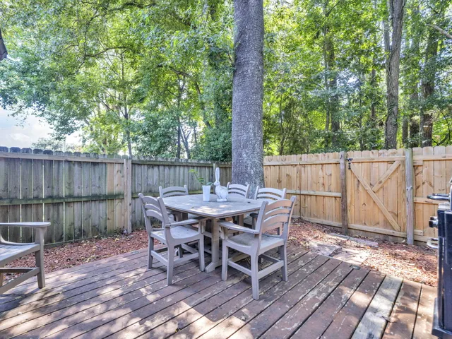 a view of a dinning table and chairs in the patio