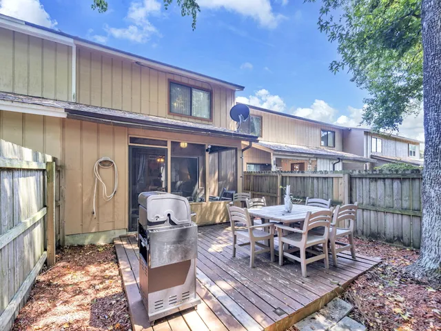 a view of a patio with a table and chairs