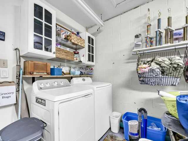 a utility room with dryer and washer